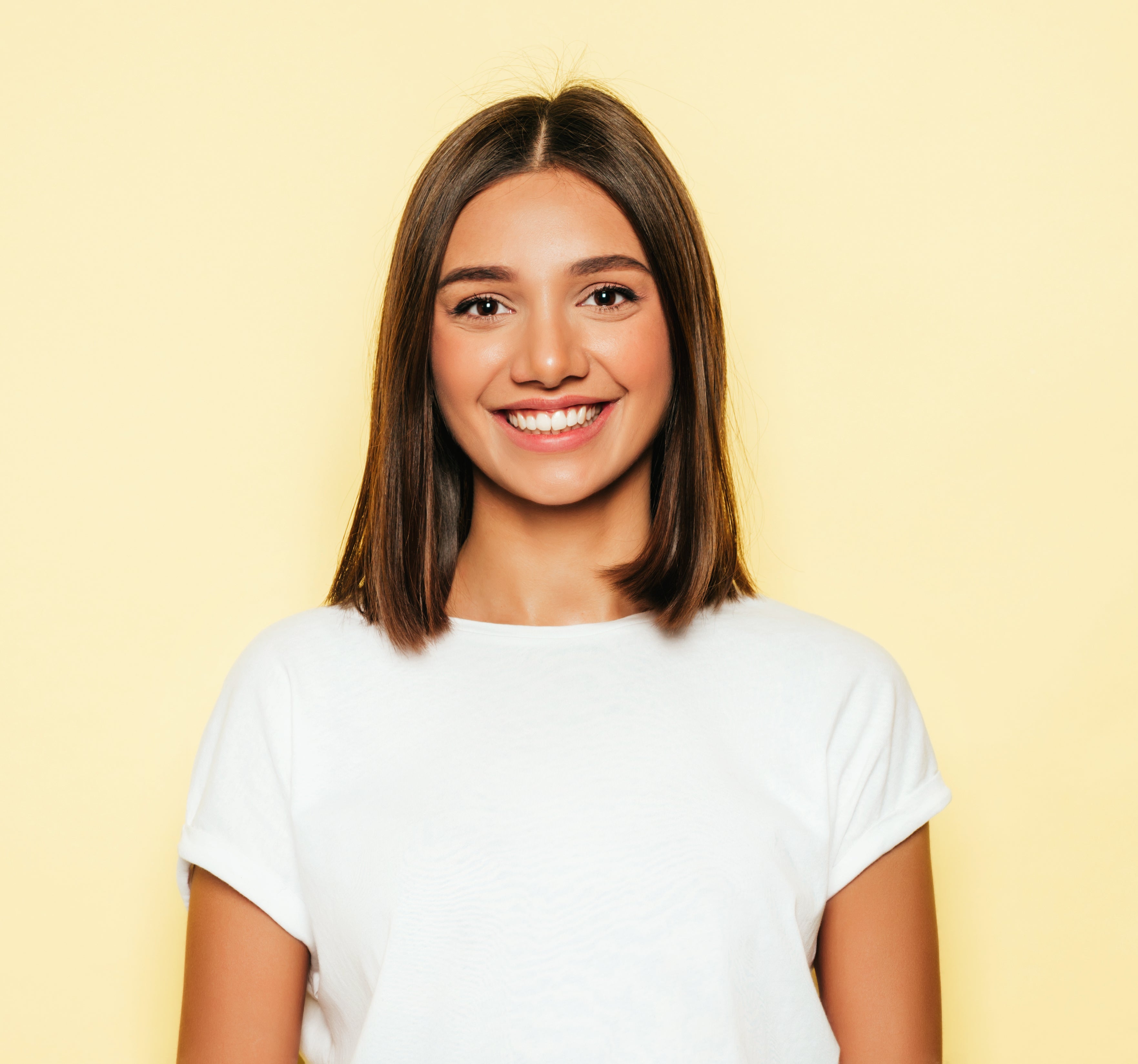 files/young-beautiful-woman-looking-camera-trendy-girl-casual-summer-white-t-shirt-jeans-shorts-positive-female-shows-facial-emotions-funny-model-isolated-yellow.jpg